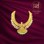 Gold Necklace with Lakshmi Pendant and Pearl Embellishments